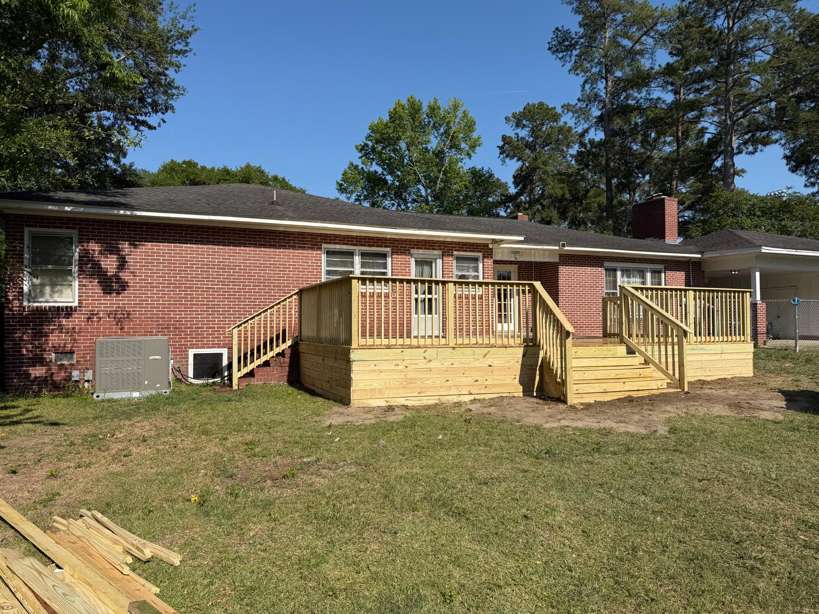 Custom Deck — Backyard deck on a brick home